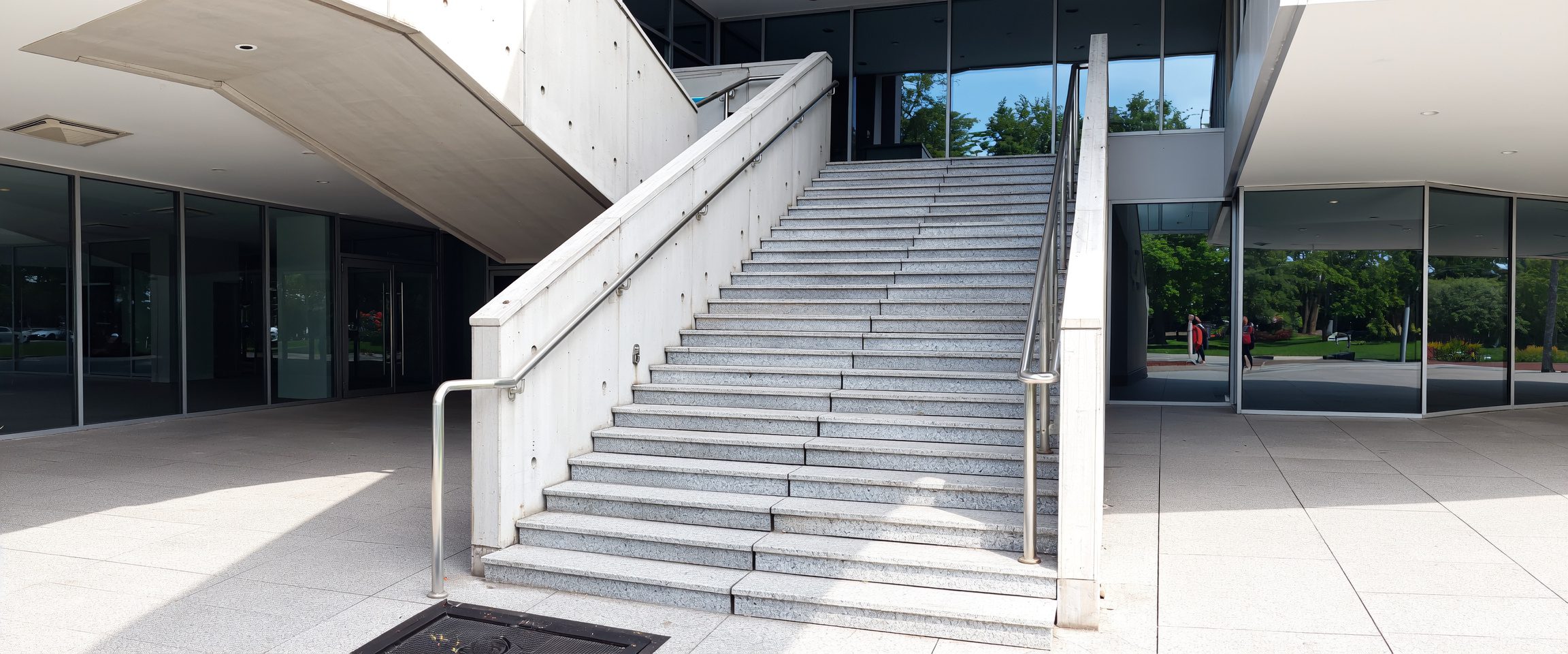 Concrete entrance after pressure washing by professional commercial cleaners in Canberra